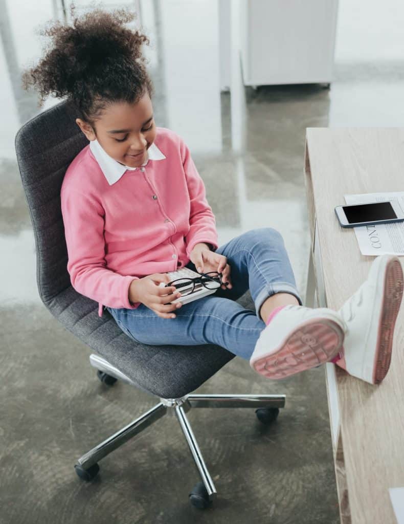 girl sitting aonkids desk chair