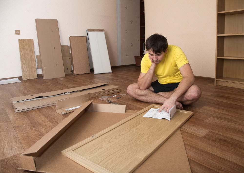 man assembling furniture
