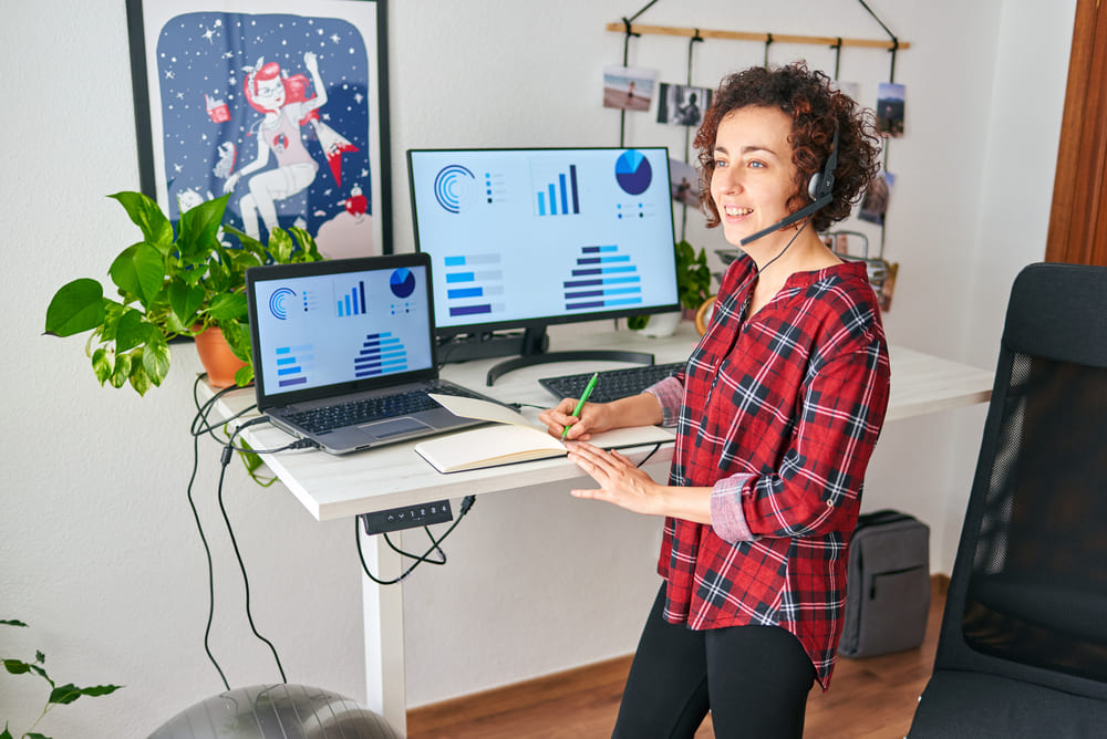 woman in front of standing desk