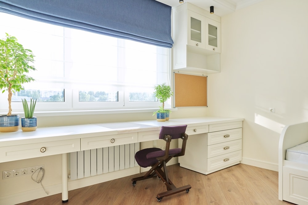 purple kneeling chair in white room