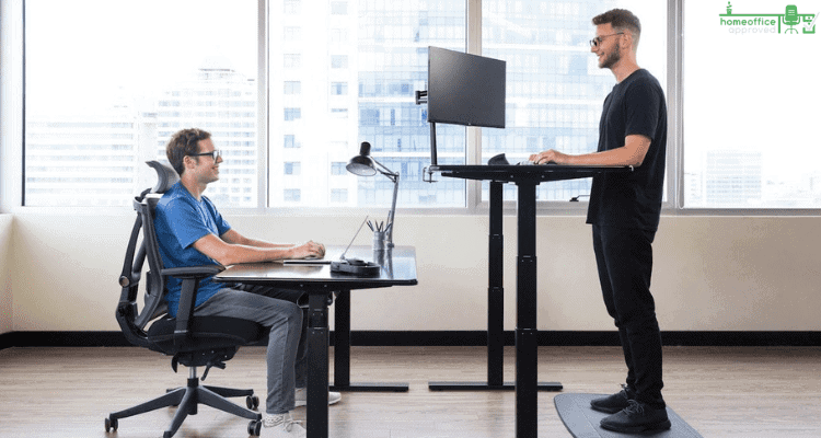 man on sitting and standing desk