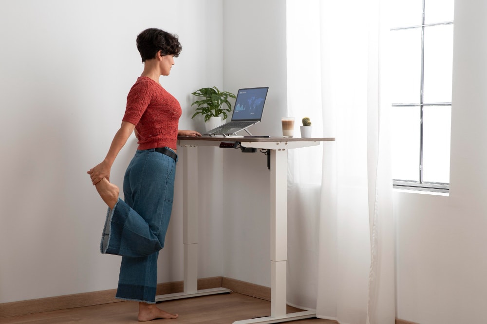 woman stretching at standing desk